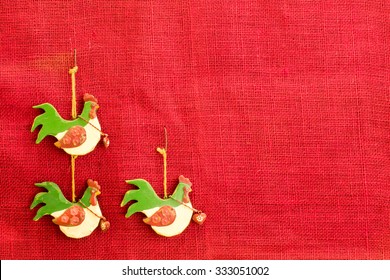 Three French  Hens On Red Hessian Background