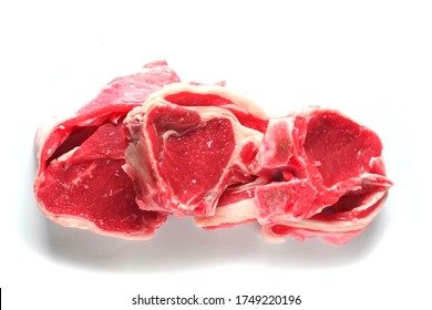 Three Fresh Raw Lamb Loin Chops On A White Background, Isolated. Meat Industry.