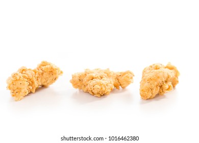 Three Freshly Fried Chicken Tenders Isolated On A White Background 