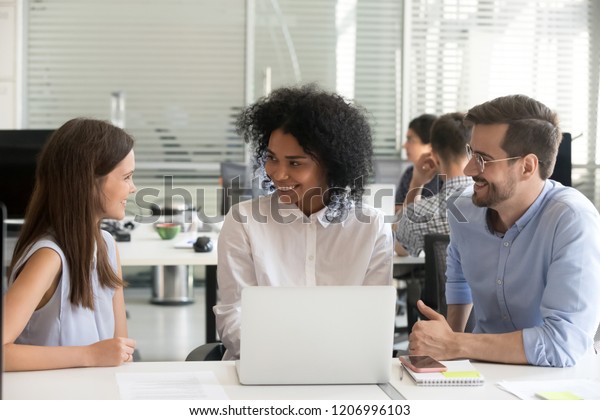 Three Friendly Diverse Colleagues Work Together Stock Photo 1206996103 ...