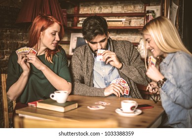 Three Friends Playing Card Game.