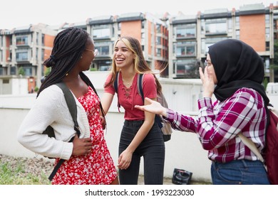 Three Friends Talking And Laughing In The Campus