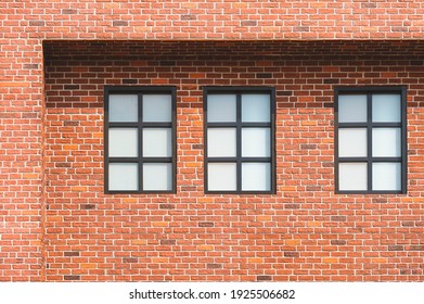 Three Frosted Glass Windows On Brick Wall Of Vintage House Building