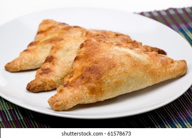 Three Fruit Turnovers On Plate.