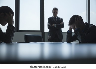 Three Frustrated And Overworked Business People 