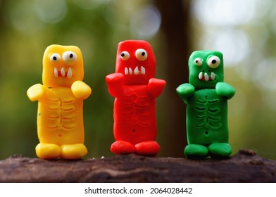 Three funny colorful zombies. Halloween decorations. Zombie apocalypse. Funny monsters.