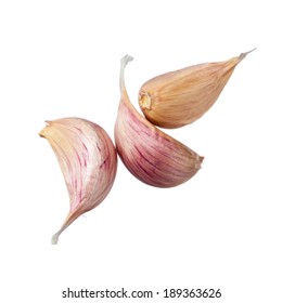 Three Garlic Cloves Isolated On White Background