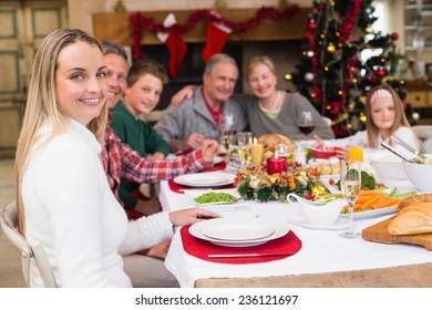 Three generation family having christmas dinner together at home in the living room