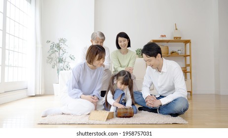 Three Generation Family Playing In The Living Room