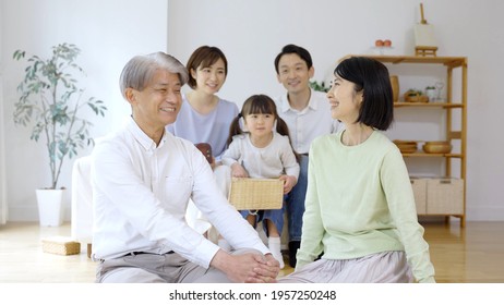 Three Generation Family Relaxing In The Living Room