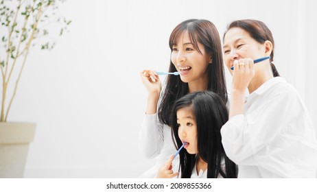 A three generation family taking care of their oral health - Powered by Shutterstock