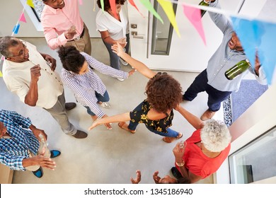 Three Generation Family Throwing A Surprise Party Welcoming Guests At The Front Door,overhead View