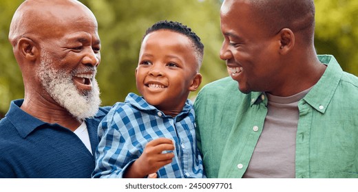 Three Generation Male Family Laughing Hugging Grandson Standing Outdoors In Countryside - Powered by Shutterstock