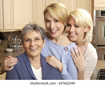 Three Generations Of Beautiful Women Smiling In A Kitchen