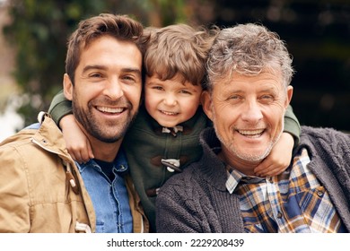 Three generations of the boys. Shot of a grandfather, his adult son and grandson enjoying a day outdoors.