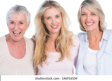 Three Generations Of  Cheerful Women Smiling At Camera On White Background