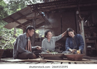 Three generations come together in a rustic outdoor kitchen, sharing a moment of cooking and storytelling, reflecting deep family bonds and traditions.