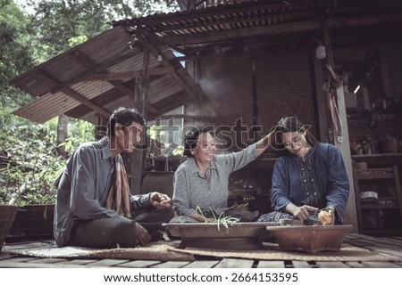 Three generations come together in a rustic outdoor kitchen, sharing a moment of cooking and storytelling, reflecting deep family bonds and traditions.