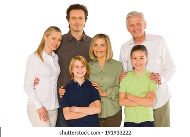 Three Generations Family Standing Isolated On White Background