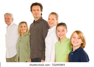 Three Generations Family Standing Isolated On White Background