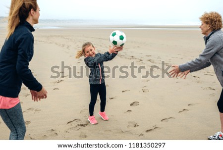 Similar – Girl and senior woman playing on the beach