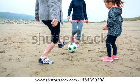 Similar – Three generations female playing on the beach