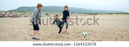 Similar – Image, Stock Photo Three generations female playing soccer on the beach