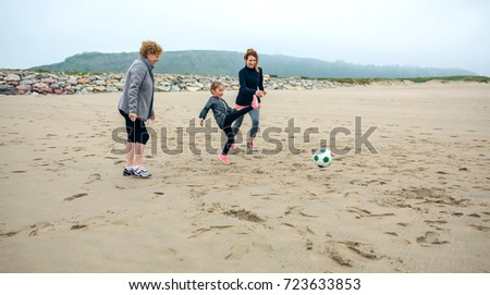 Image, Stock Photo Three generations female playing soccer on the beach