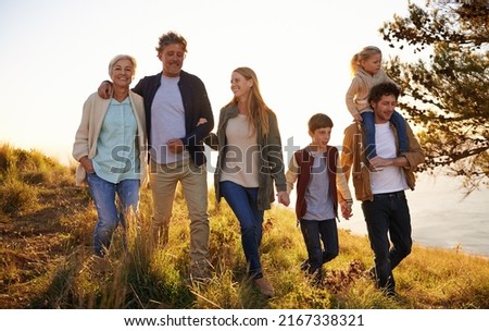Three generations of happiness. Shot of a happy family out on a morning walk together.