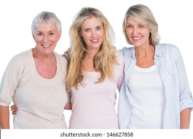Three generations of  happy women smiling at camera on white background