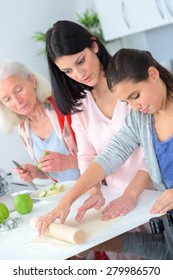 Three Generations Of Women Baking Together