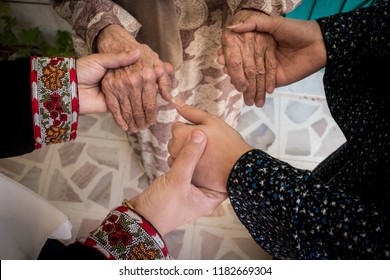 Three Generations Women Holding Hands