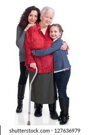 Three Generations Of Women On A White Background