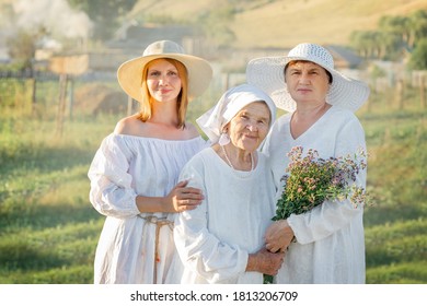 Three Generations Of Women Of The Same Family At Sunset