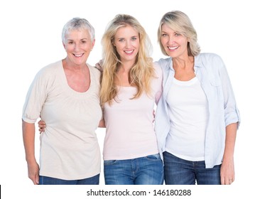 Three generations of women smiling at camera on white background
