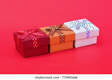 Three Gift Boxes On Red Background Stock Photo 772445668 | Shutterstock