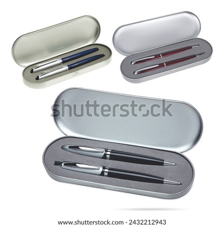 Three gift pens in classy, opened soft silver colored metal pencil box. Gift box packaging for promotional branding. Promotional gift twin pens in metal box. Silver, blue and red colored pens.