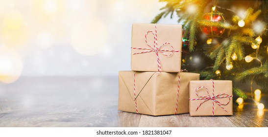 Three Gifts On The Floor Under The Christmas Tree