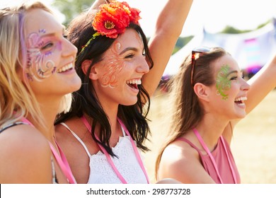 Three Girl Friends At A Music Festival