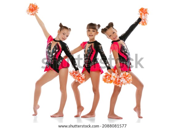 Стоковая фотография 2088081577 Three Girls Cheerleaders Colorful