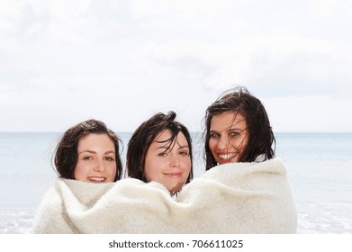 Three Girls Sharing A Blanket