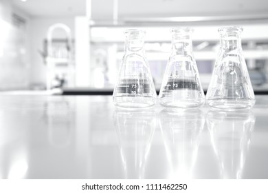 Three Glass Flask In White Clean Research Chemistry Science Laboratory Background 