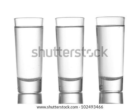 Three glass of vodka isolated on white