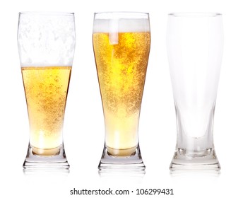 Three glasses of beer with one full, one half gone, and one empty isolated on a white background.