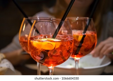 Three Glasses Of Campari Orange On The Table