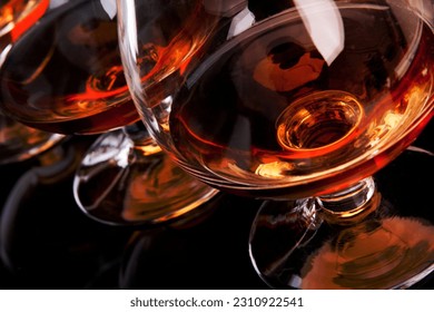 Three glasses of cognac in a row