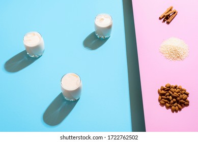 Three glasses with horchata and ingredients on bicolor background. Making of horchata, a Mexican summer non-alcohol drink with milk, almonds and rice - Powered by Shutterstock