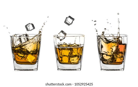 Three glasses of splashing whiskey with ice isolated on white - Powered by Shutterstock