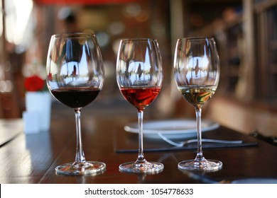 Three Glasses Tester Of Different Wine On A Table