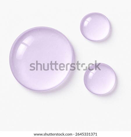 Three glossy translucent drops with a light purple tint on a white background. Dew-like texture, varying sizes, isolated and soft shadows, resembling liquid marshmallow